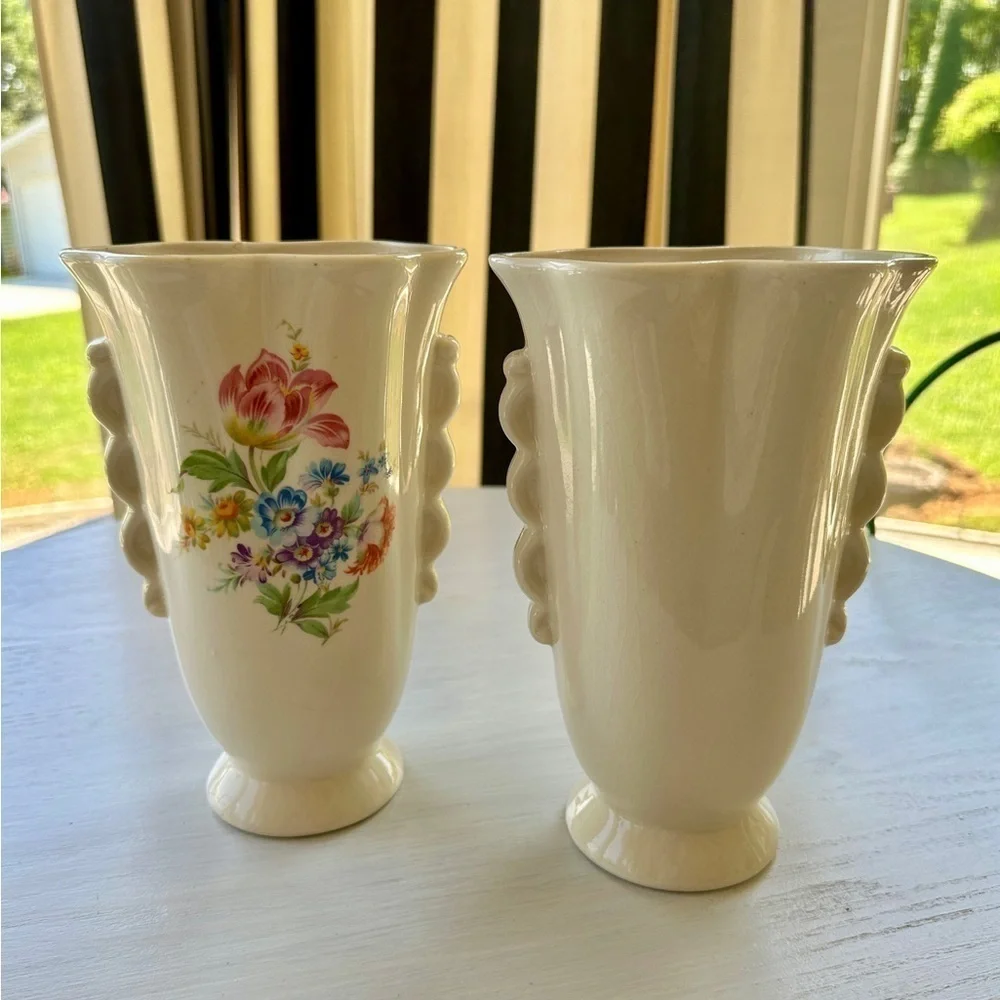 1950’S SET/2 , FLORAL VASES. SOFT CREAM COLOR WITH ONE SIDED FLORAL DESIGN.